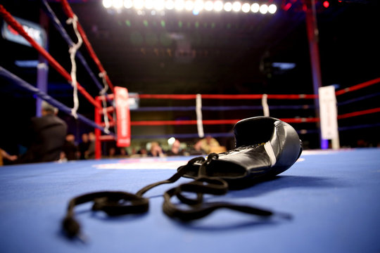 Boxing gloves in boxing ring