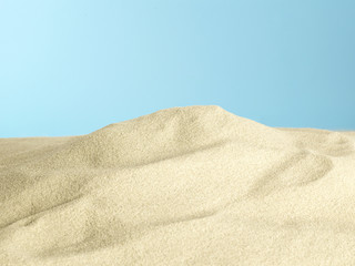 Sand pile on blue background