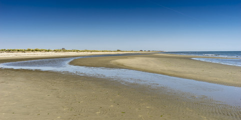 Obraz premium beach on the adriatic sea,at the mouth of the river Pò