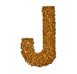 Letters of the alphabet made from buckwheat on white background