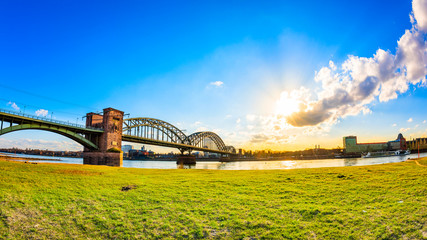 Beautiful place in Cologne, meadow at the Rhine River in bright sunshine