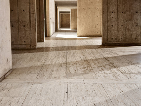 Sunlight on concrete walls in empty building