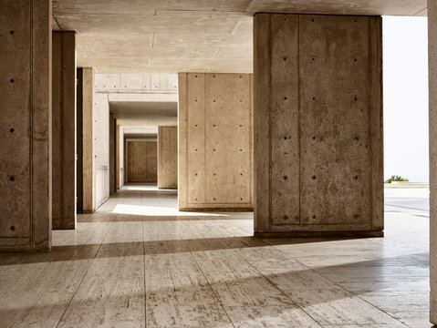 Sunlight on concrete columns in empty building