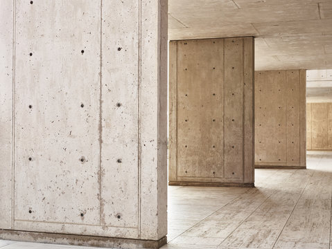 Sunlight on concrete columns in empty building