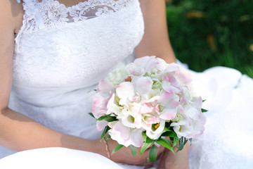 Beautiful wedding bouquet in the bride's hands. Wedding day.