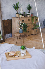 Breakfast in bed, fragrant tea and croissants for breakfast