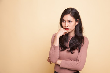 Fototapeta premium Serious young Asian woman look away.