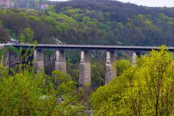 Fototapeta na wymiar Old bridge over the river in the countryside