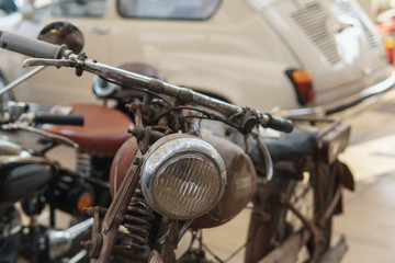Old motorcycle in a retro store. Front view