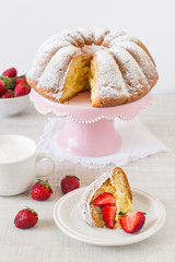 Homemade vanilla cake with strawberries close-up on the table