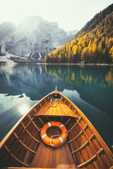 Naklejka premium Traditional rowing boat on a lake in the Alps