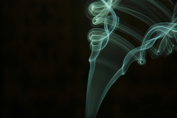 green smoke on black background