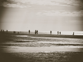 Walking people at the beach