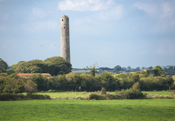 Fototapeta na wymiar Irish roundtower in the distance