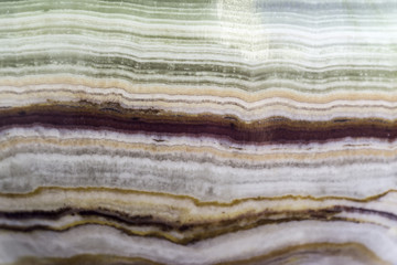 Macro photo texture of polished onyx stone. Photo for the site about geology, stones, jewelry, handwork, textures, art. © sheris9