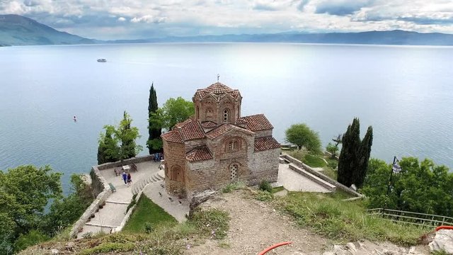 Ohrid showing church of Saint John at Kaneo and lake in the background, steadicam cinematic shot