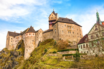 Fototapeta na wymiar Amazing landmark in Czech Republic, near Karlovy Vary Loket middleaged castle with blue sky in spring.