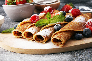Delicious Tasty Homemade crepes or pancakes with raspberries and blueberries