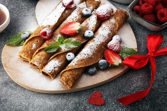 Delicious Tasty Homemade crepes or pancakes with raspberries and blueberries