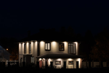 Fototapeta na wymiar modern house at night with lights
