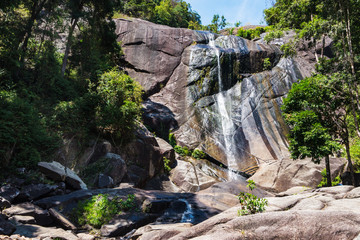Great waterfall in rocky mountains on tropical island Langkawi in Asia. Seven Wells Waterfall in Malaysia