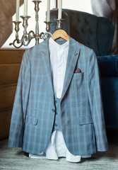 businessman's jacket is hanging in the room