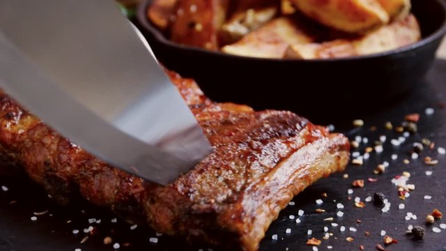 pork meat rib grilled roast barbecue cut with a knife
