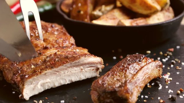 pork meat rib grilled roast barbecue cut with a knife
