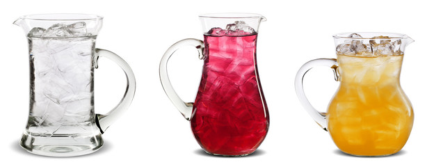 Three pitchers with water, red and orange juice in isolated background