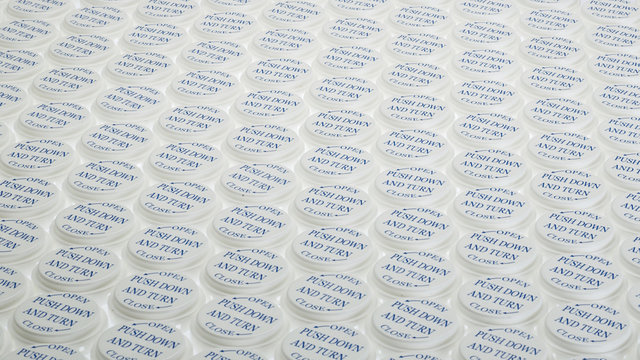 Pill bottle caps in a row
