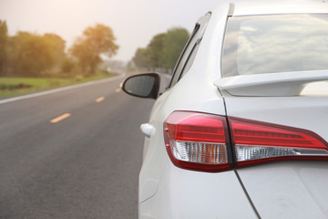 Car on road with sunset 