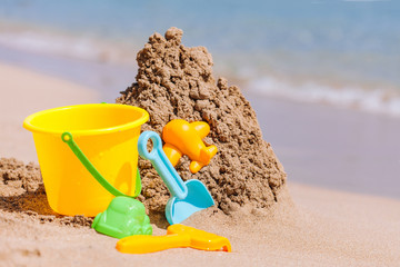 Fototapeta na wymiar kids toys on tropical sand beach