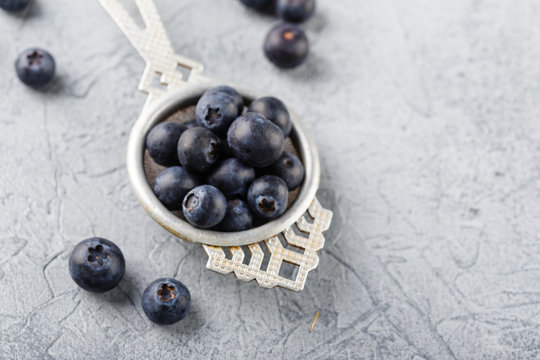 Blueberries in a small metal strainer