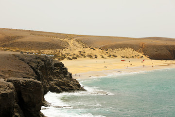 Beautiful wild beach with desert dunes and rocks, Playas de Papagayo, Lanzarote, Canary Islands