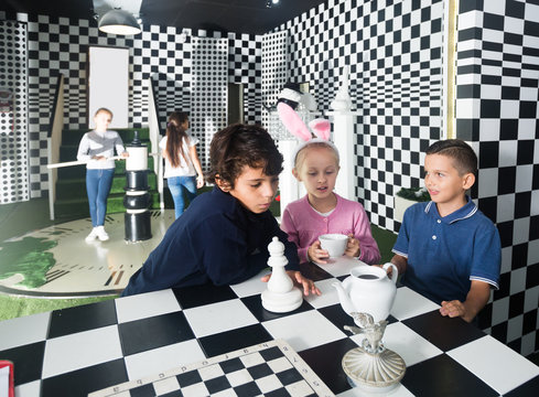 friends play in quest room in chess style