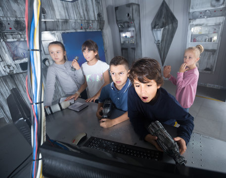  children play in the quest room of a inscrutable bunker