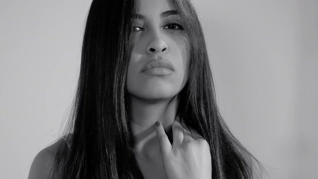 Sad hispanic female model unhappy black and white