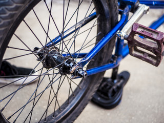 close up teenager repairing bmx bike