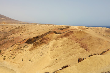 Fototapeta na wymiar Desert in Lanzarote. Sand dunes near Playa Papagayo beach, Canary Islands.