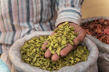 cardamom in the man's hand