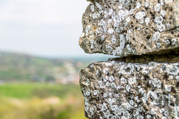 the old stone against the sky, old concrete wall background with place for text, template for the writing of the text