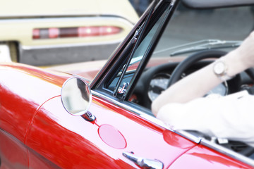 open red cabriolet with female driver