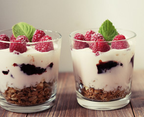 Natural yogurt with fresh berries and muesli. Healthy dessert.