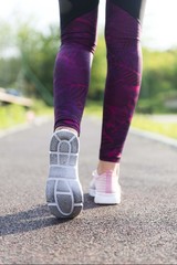 Girl athlete running. Fitness sport shoes isolated. jogging background.