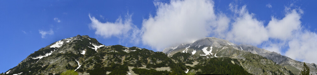 Obraz na płótnie Canvas Panorama of Vihren mountain summit under fog, Pirin, Bulgaria