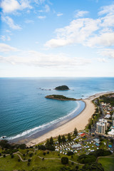 Fototapeta na wymiar Landscape view of the city and ocean below Mount Maunganui in New Zealand. 