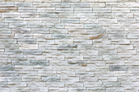 Surface wall of stone wall gray tones for use as background.