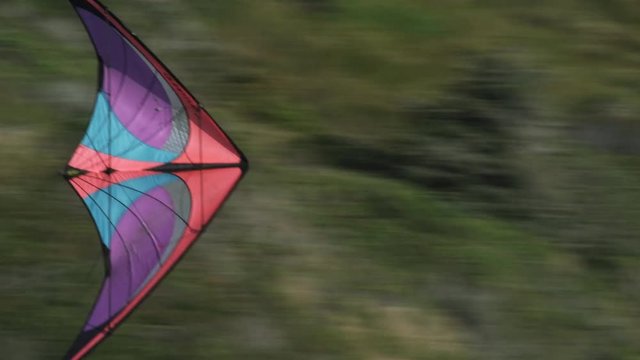 Tracking a colorful kite at a coastal kite festival