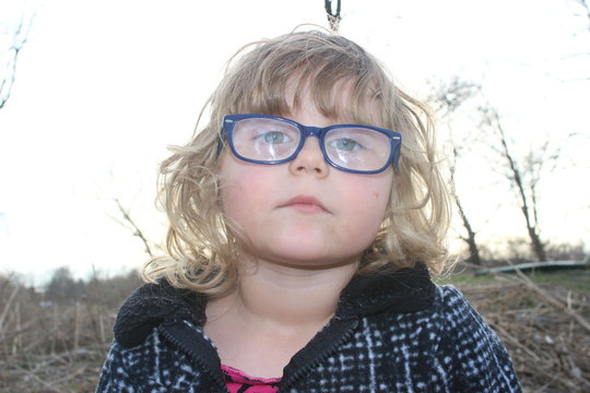 nerdy little girl with big glasses