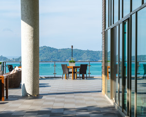 patio chair and table with sea view background